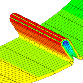 Das Bild zeigt eine technische Simulation oder Analyse eines Rohrsystems mit farblich markierten Belastungs- und Druckzonen. Die Darstellung verwendet ein Farbverlauf von Grün über Gelb bis Rot, um unterschiedliche Spannungen oder Belastungen im Material zu verdeutlichen. Im Zentrum ist eine scharfe Biegung des Rohres zu sehen, die blau markiert ist und auf eine kritische Stelle hinweist, während die geraden Abschnitte überwiegend rot und gelb gefärbt sind. Die gesamte Grafik ist auf einem weißen Hintergrund dargestellt und zeigt eine detaillierte Netzstruktur zur Berechnung.